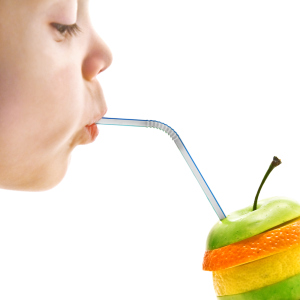child drink the fruit juice